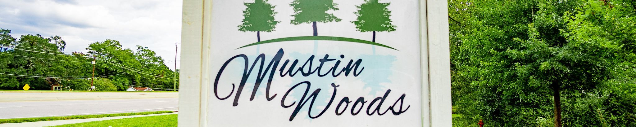 mustin woods apartment sign